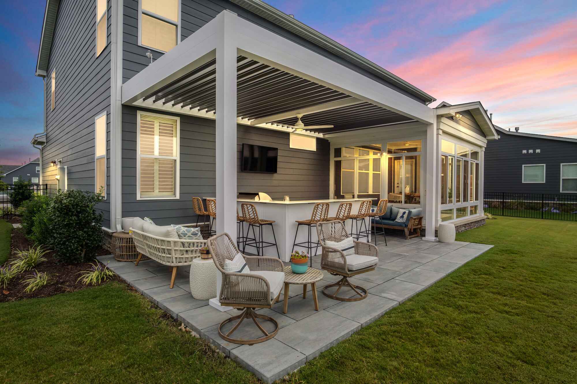 Azenco Motorized Pergola with Louvered Roof and Entertainment Space