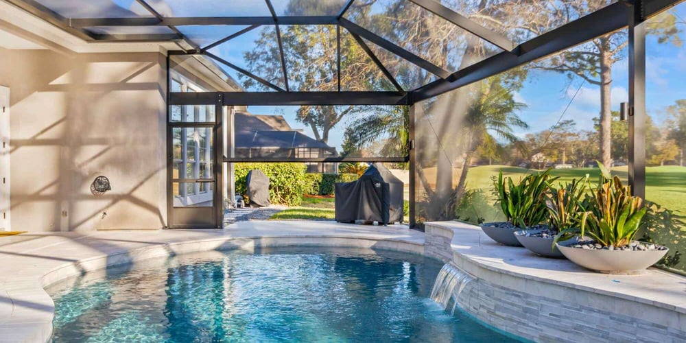 Motorized screen patio pool enclosure by Impact Enclosures in Jacksonville, FL