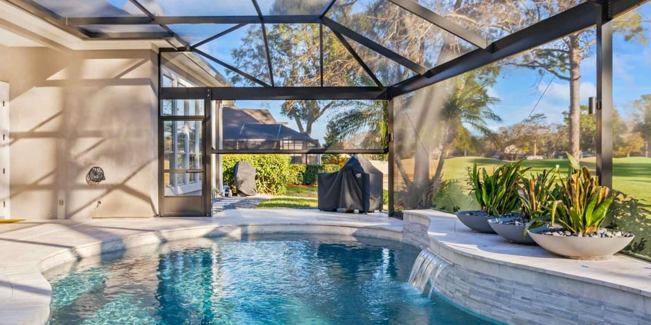 Motorized screen patio pool enclosure by Impact Enclosures in Jacksonville, FL