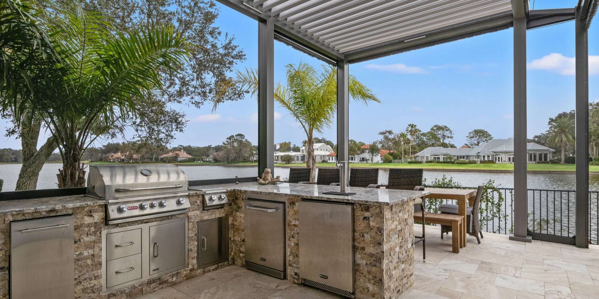 Outdoor Kitchen with stone features in Jacksonville, FL by Impact Enclosures