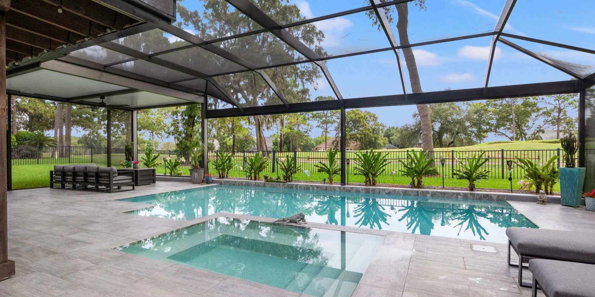 Large outdoor patio and pool screen enclosure in Jacksonville by Impact Enclosures