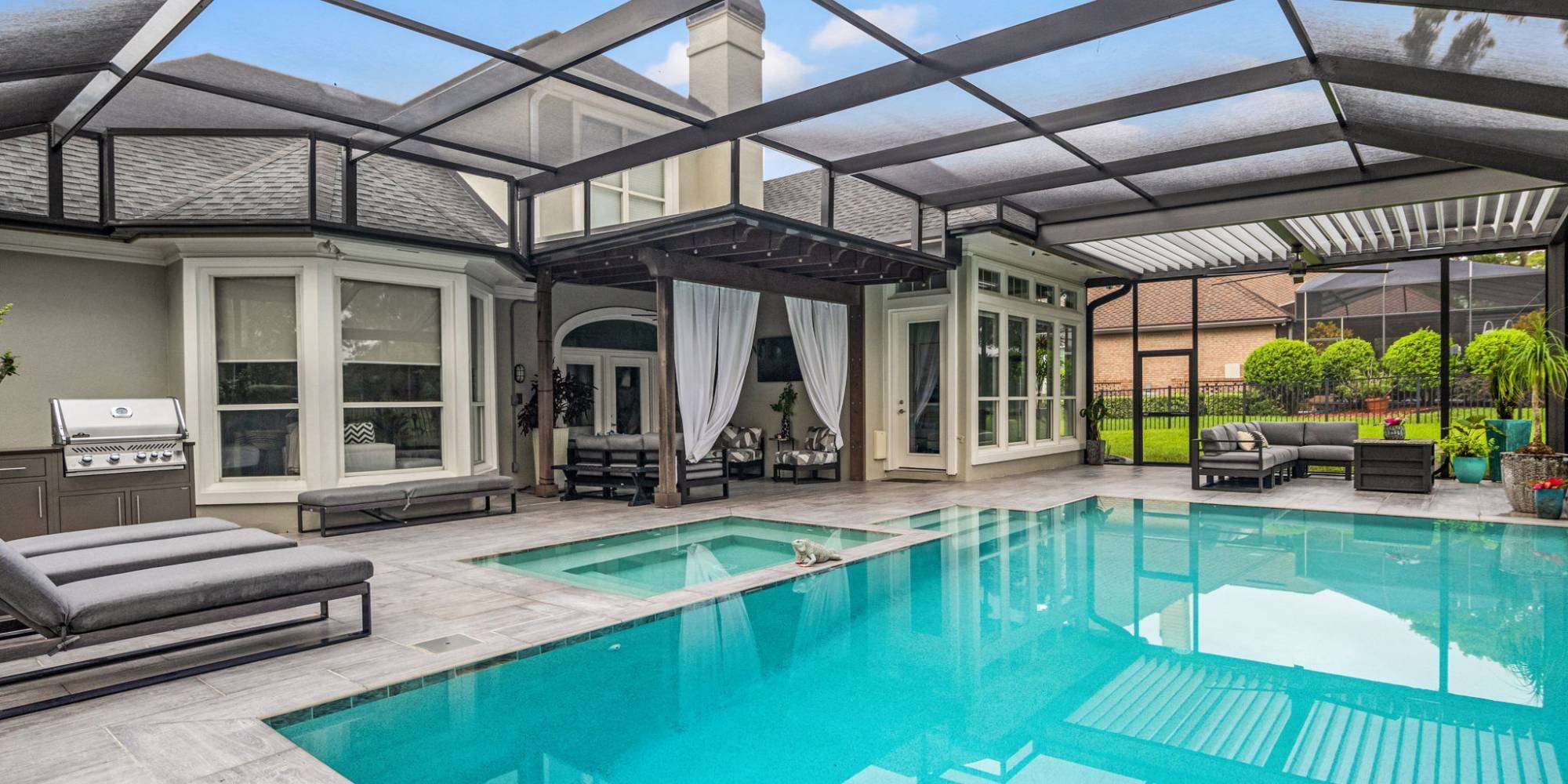 Screen-enclosed pool and patio area by Impact Enclosures in Jacksonville, FL