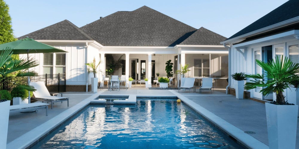 Stock Image of Pool and Pavers with Lounge Chairs and Seating