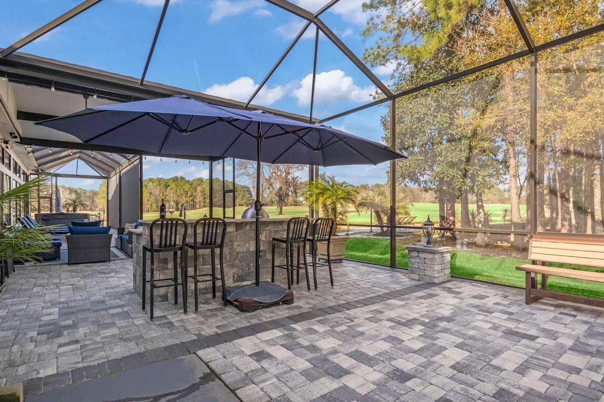Screen enclosure with outdoor cooking area in Jacksonville