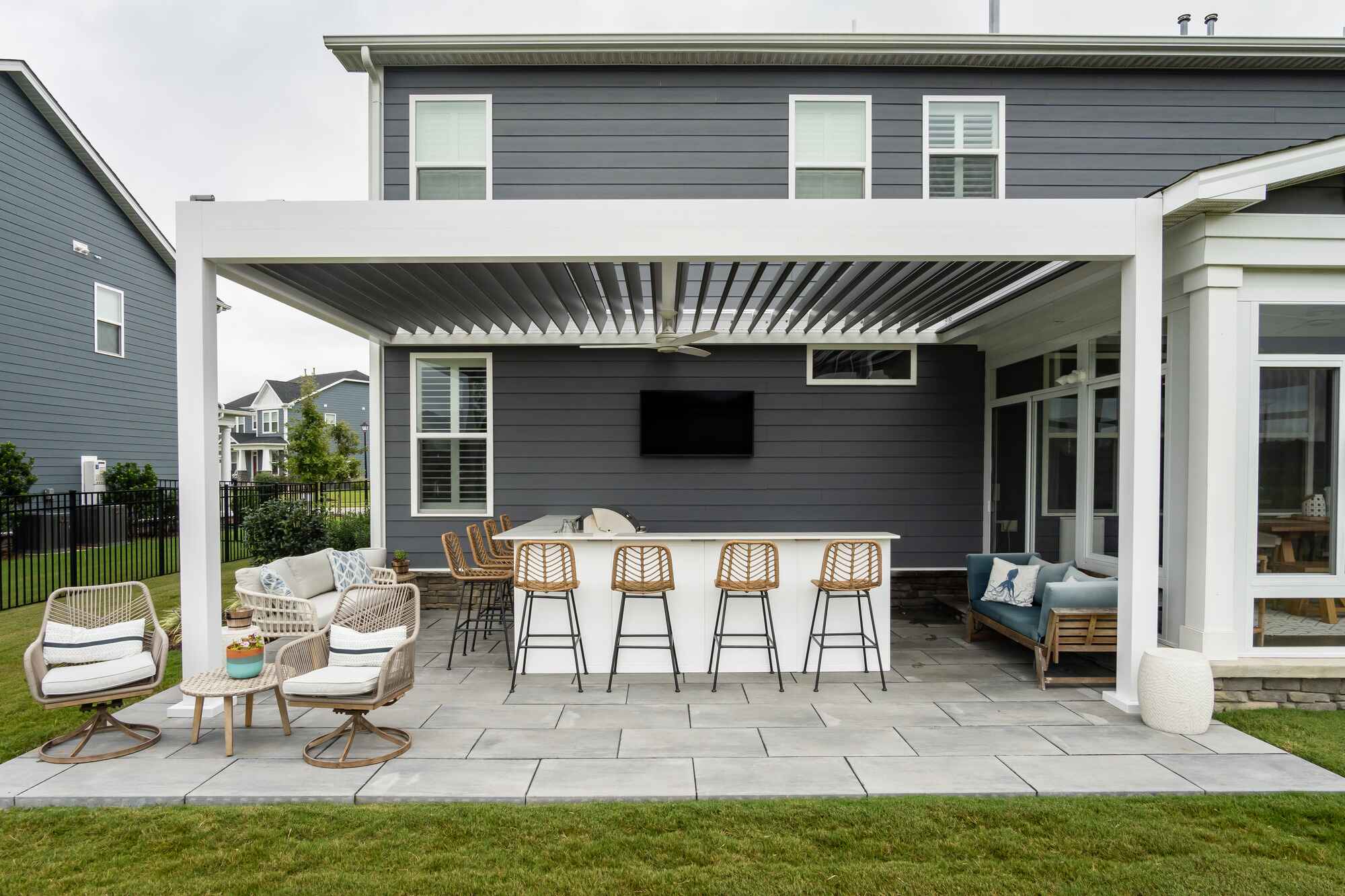 Motorized Pergola by Impact Enclosures in Jacksonville with Outdoor Kitchen