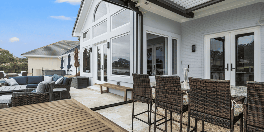 Motorized Screen in the Down Position Protecting Outdoor Kitchen