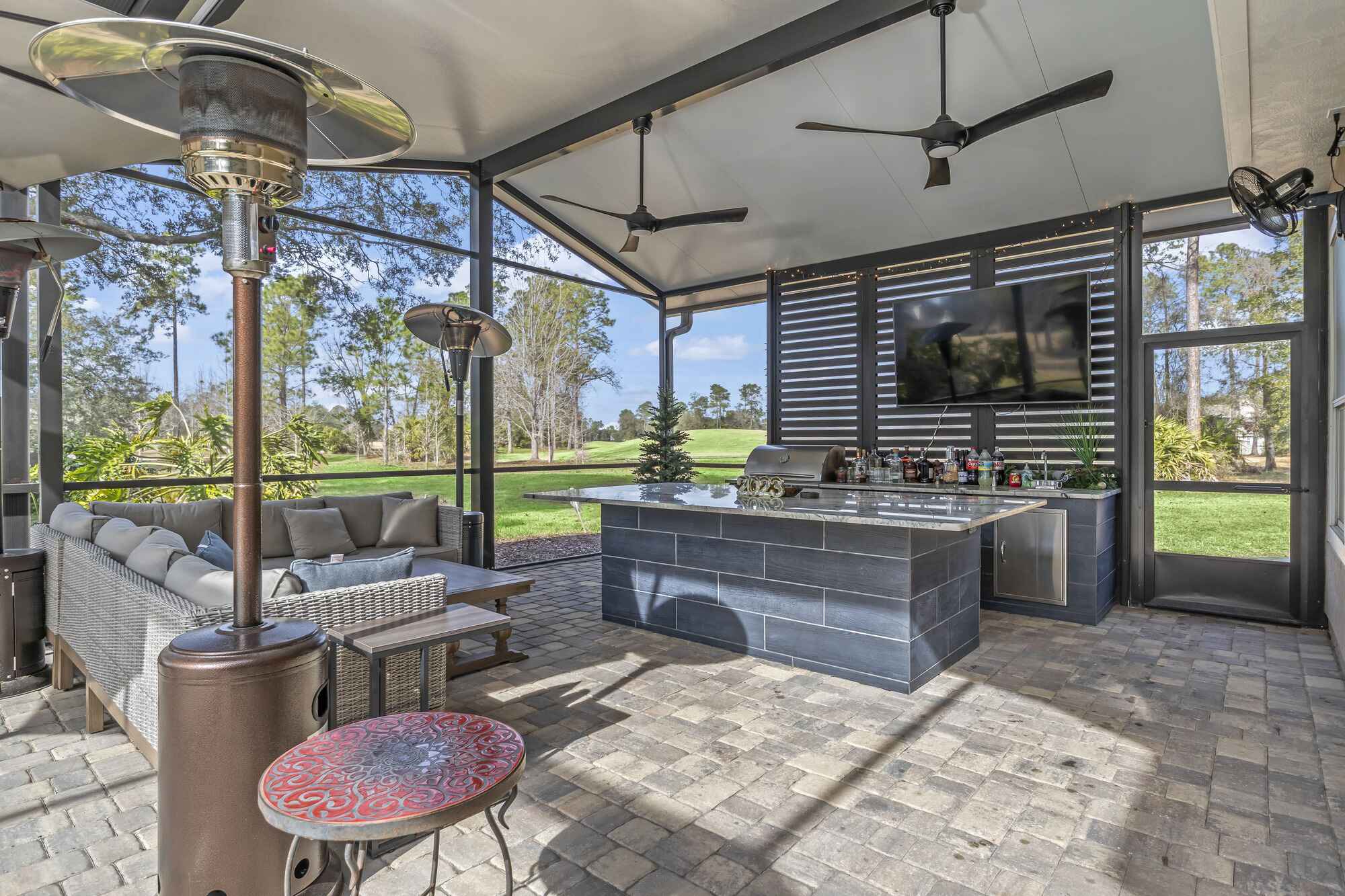 Outdoor Kitchen and Bar inside Screen Room in Jacksonville