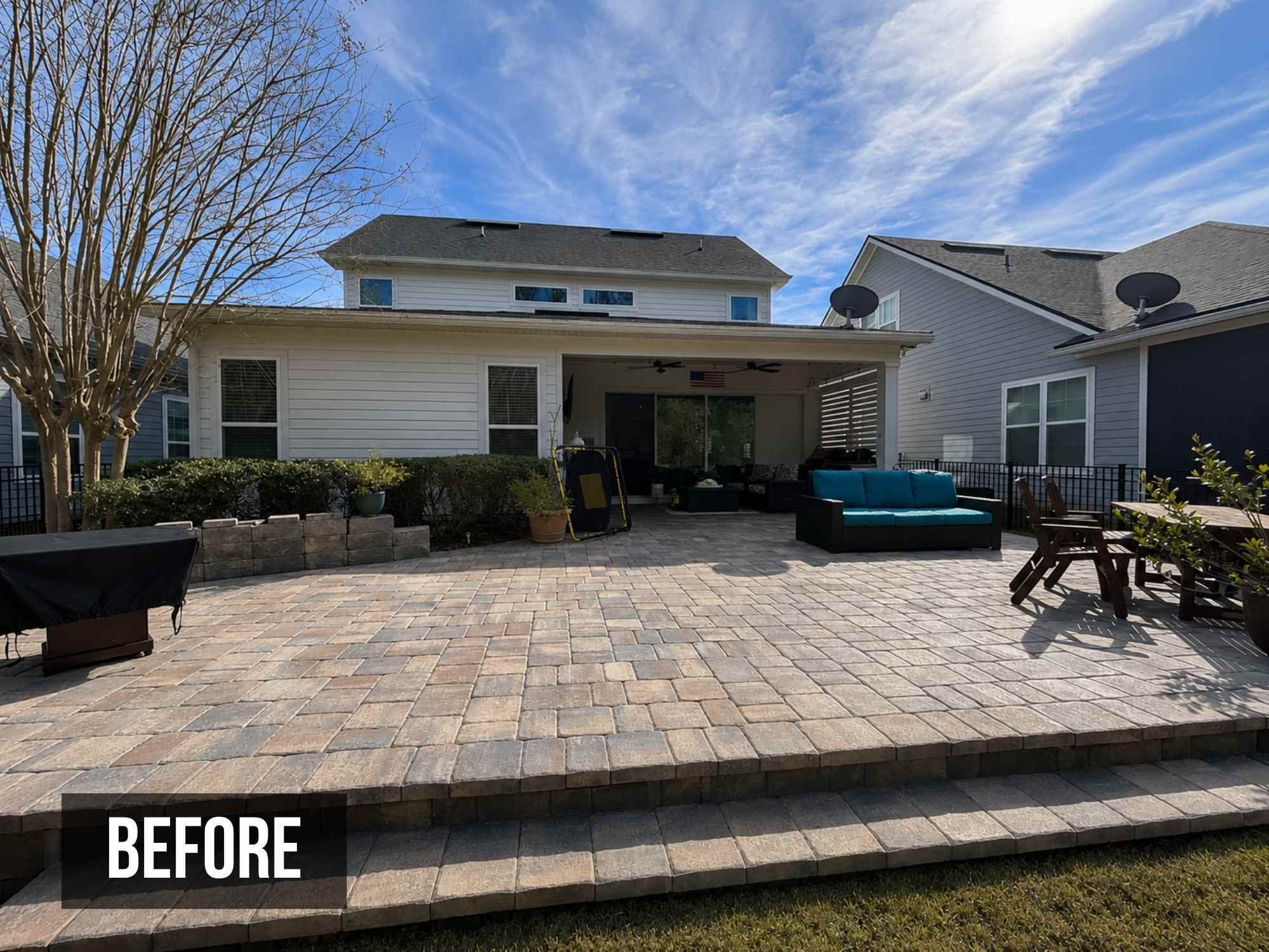 Image of the back patio of a Jacksonville, FL home before the updates made by Impact Enclosures