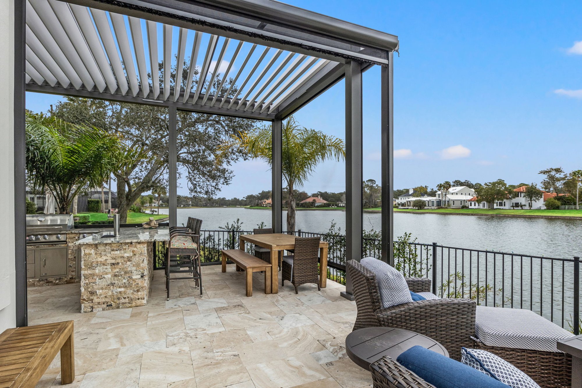 Beautiful Outdoor Living Area on Water with Summer Kitchen and Pergola