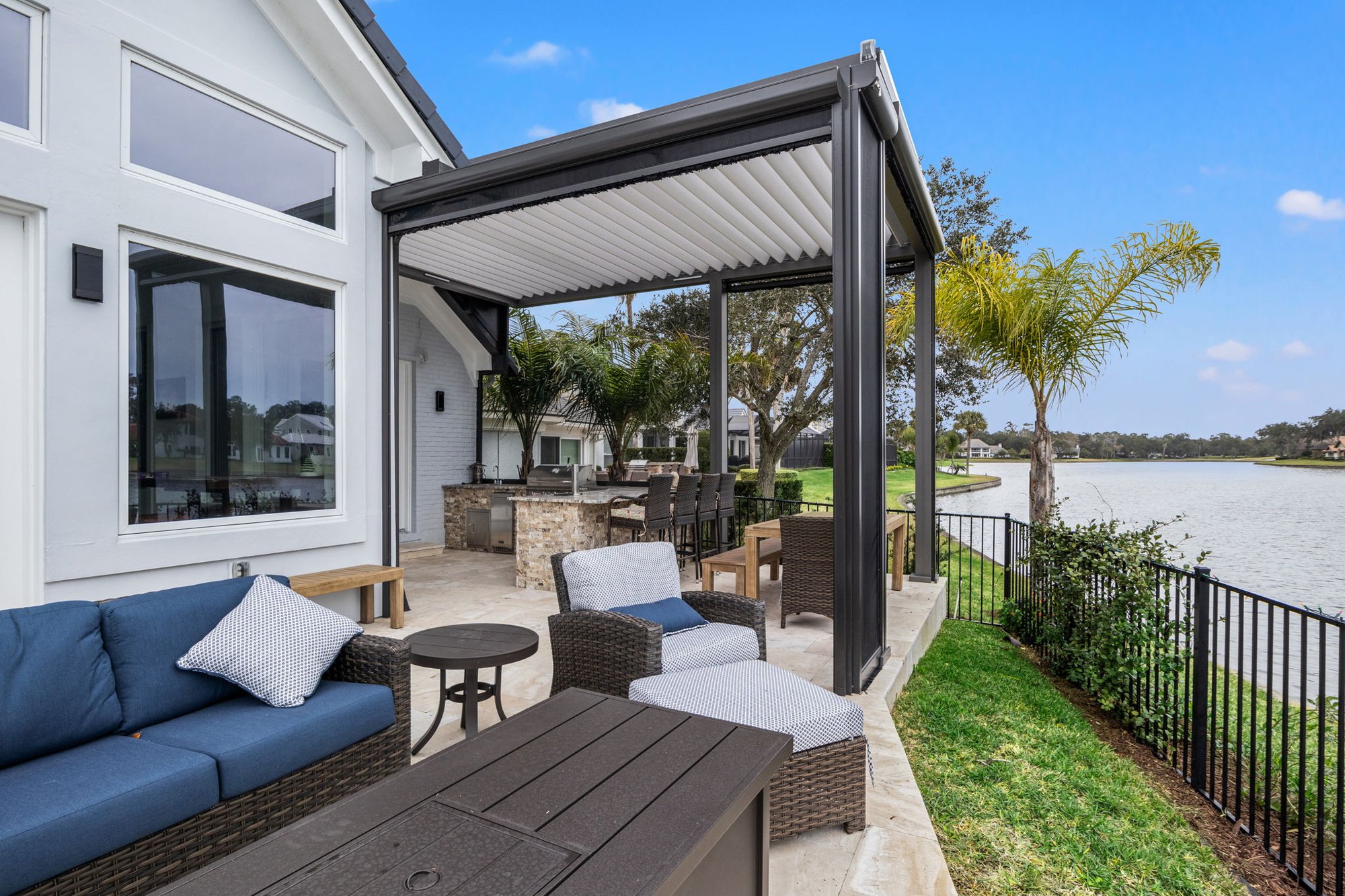 Outdoor Living Area in Jacksonville with Pergola and Motorized Screen