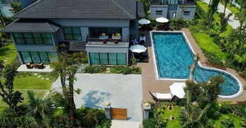 Aerial image of a backyard patio with pool and pavers in Jacksonville, FL - Impact Enclosures