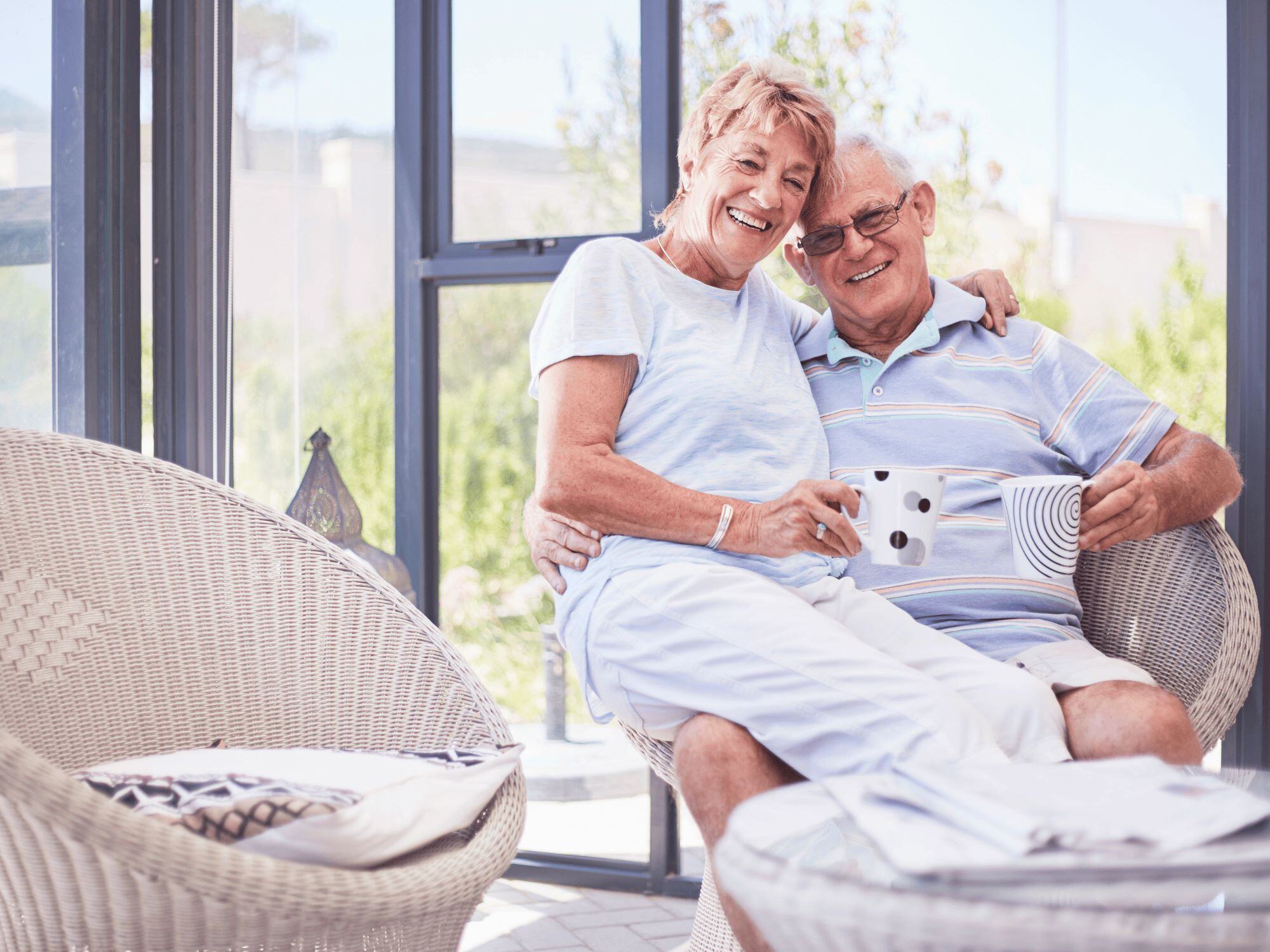 Stock Image Couple Having Coffee on Sun Porch