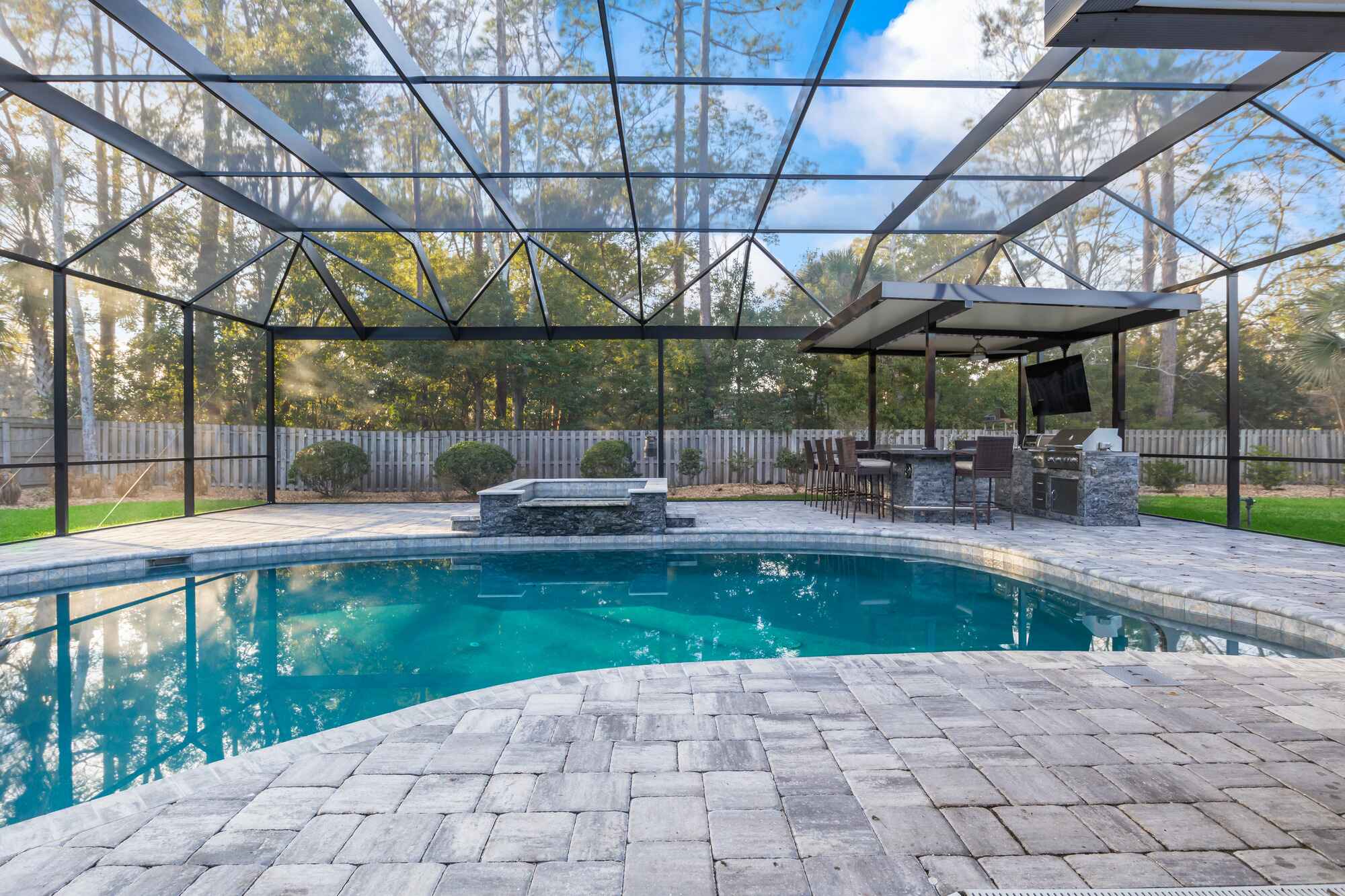 Pool Screen Enclosure with Custom Stone Patio