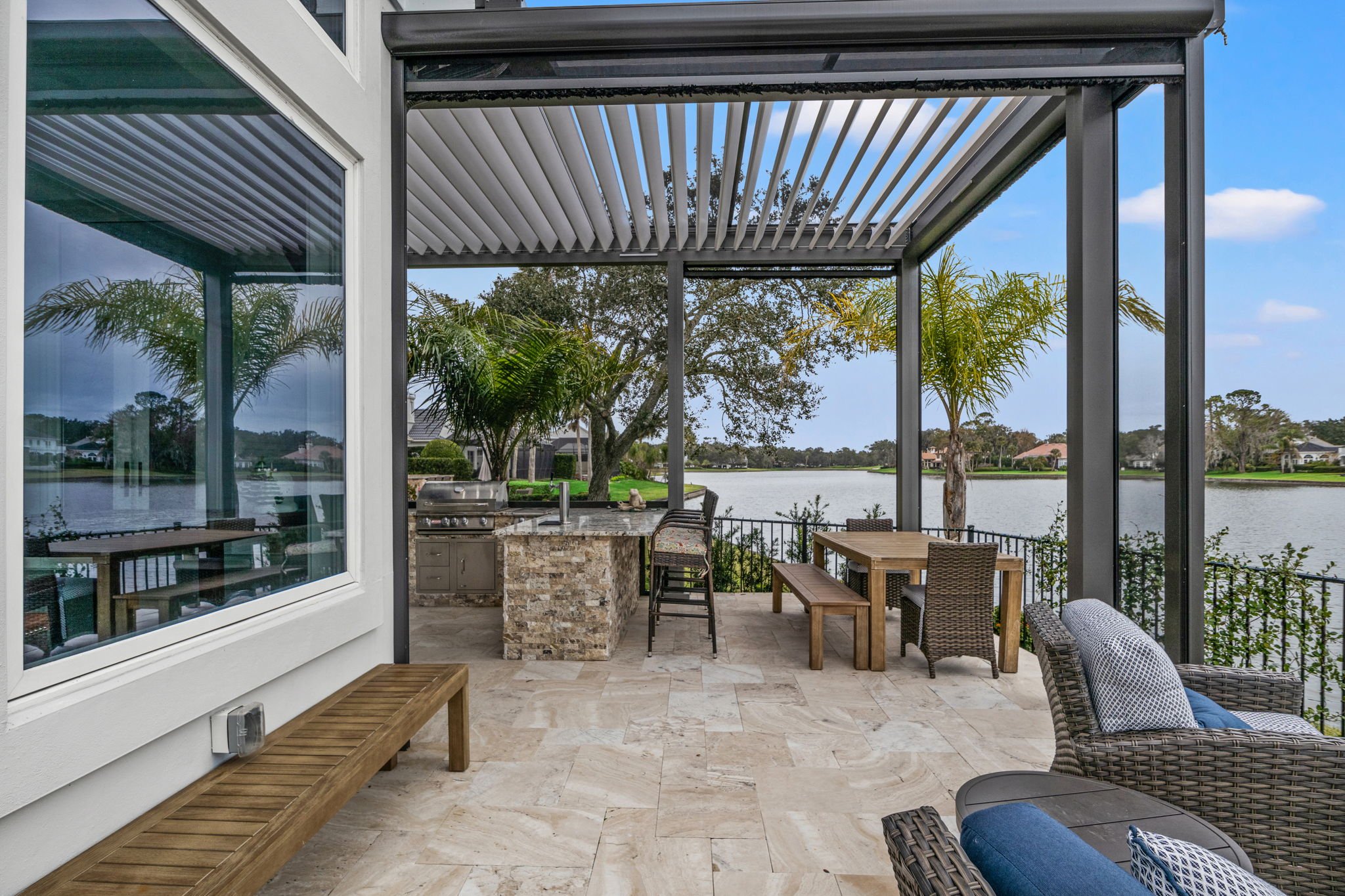 Outdoor Living Space in Jacksonville with Smart Pergola and Dining Area