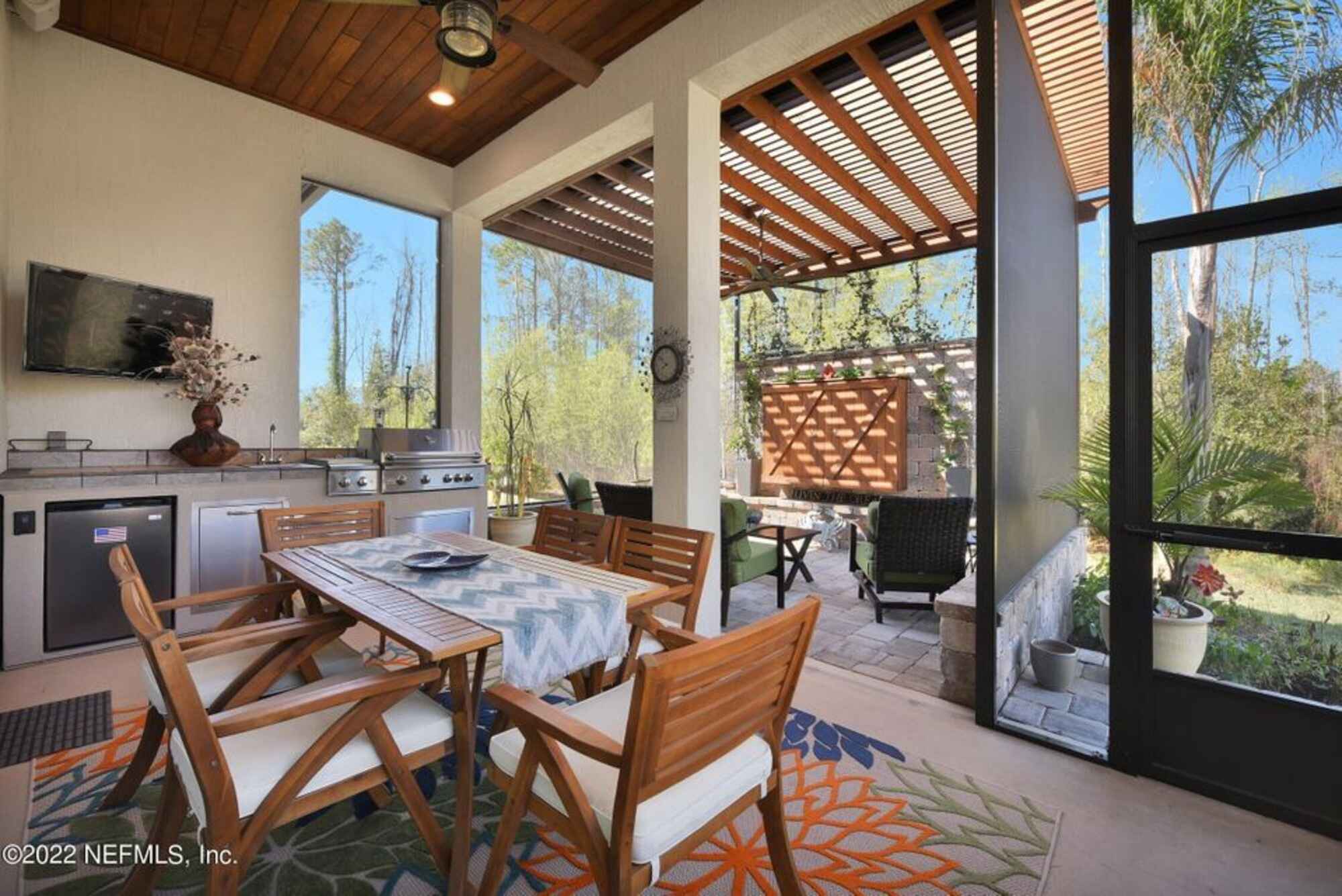 Screened Enclosure with Kitchen and Wood Pergola