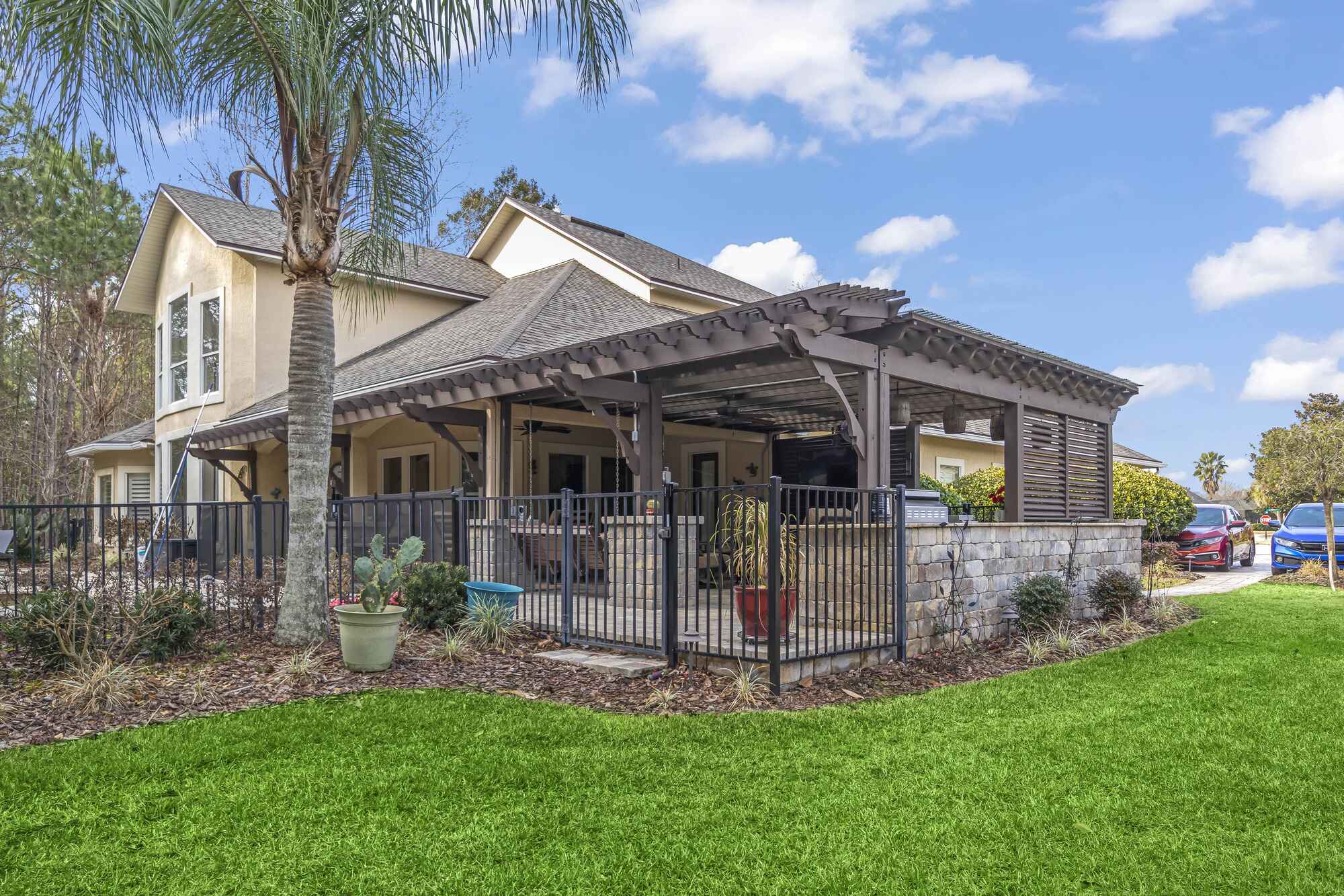 Traditional Wood Pergola by Impact Enclosures in Jacksonville